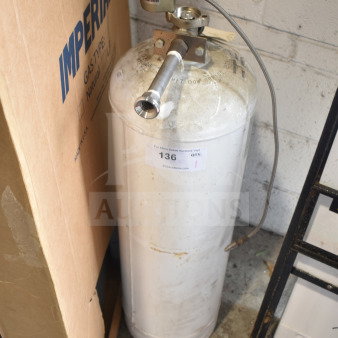 Fire suppression tank with valve and hose, labeled "136." Slight wear on the exterior. Comes with actuator connection.