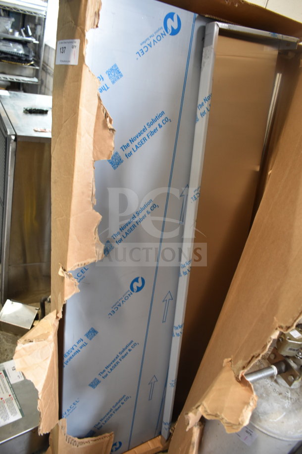Brand new Imperial shelf with minor scratches and dents. Partially unboxed, protective film visible. Auction tag "137" attached.