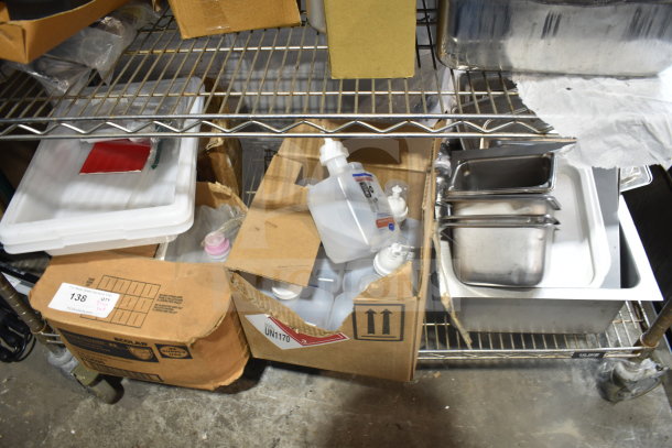Tier lot including various items like drop-in bins and alcohol foam hand sanitizer. Boxes and bins on metal shelf.