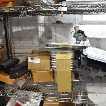 Tiered shelf with assorted items including drop-in bins, pan liners, and cardboard boxes. Visible tag marked "139".