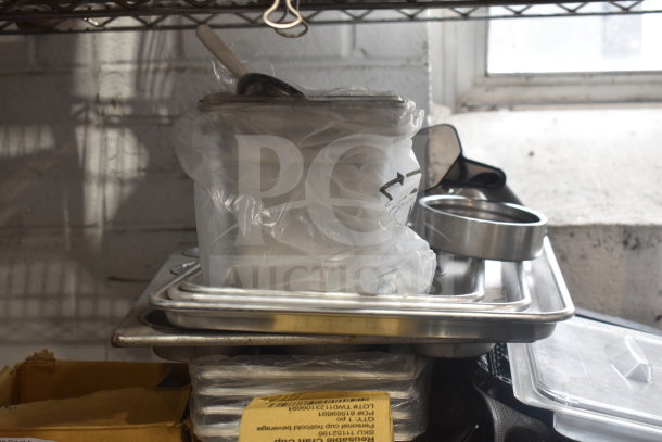 Tiered lot with various items including stainless steel drop-in bins and pan liners. Visible markings on bags indicate quantity.