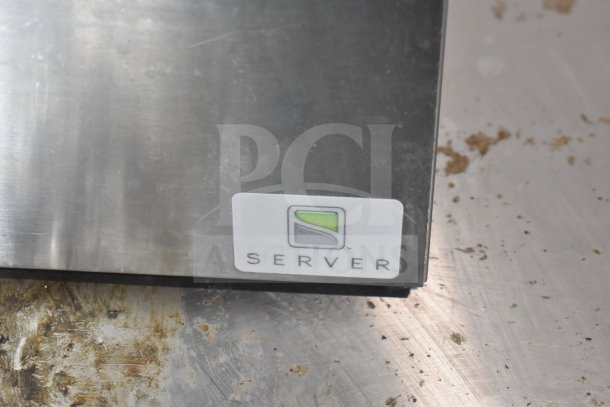 Stainless steel Server SR-2S Serving Station with visible brand logo, minor surface wear.