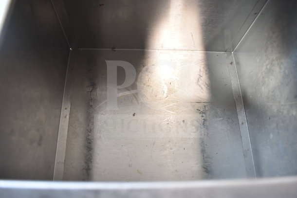 Stainless steel interior of Server SR-2S Serving Station, showing light scratches and wear, in used condition.