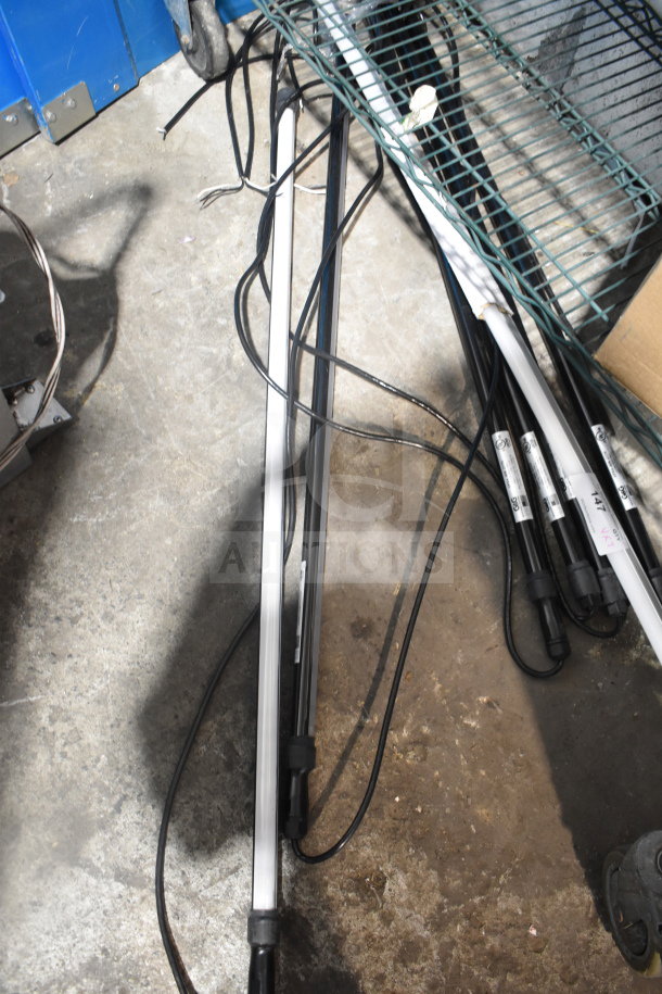 7 G&G VPX4-40K-277V lights, black and white, with visible wiring. Condition appears used. Auction for all seven lights.