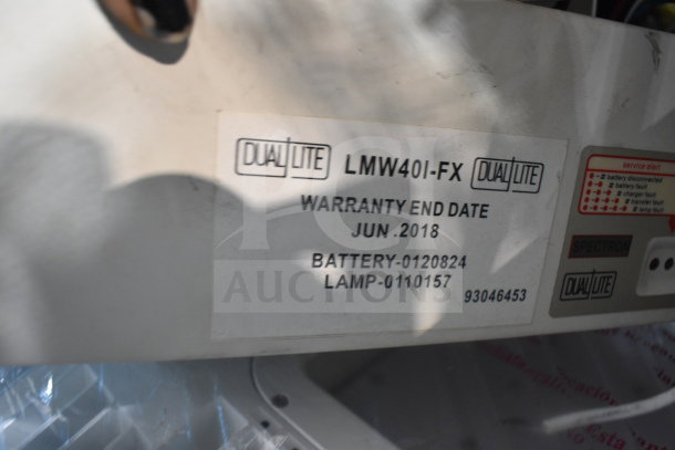DualLite LMW40I-FX exit sign warranty label, expired June 2018. Model includes Battery-0120824, Lamp-0110157.