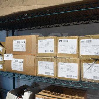 Boxes of 19 various DualLite items, including double remote heads and LED emergency lights. Label details shown.