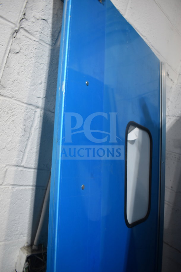 Blue kitchen traffic door with rectangular window, durable construction, minor wear, sold as a lot of two.