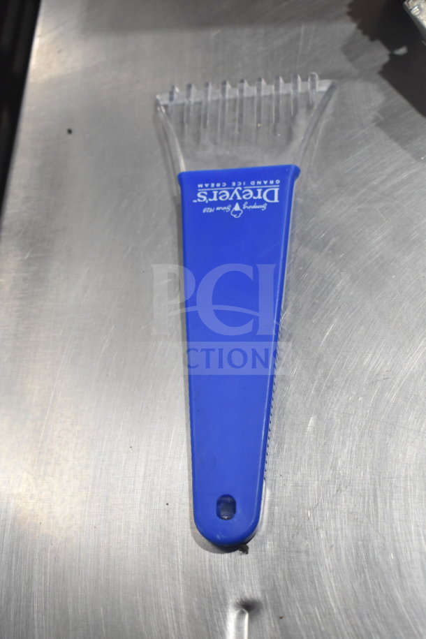 Blue ice scraper with clear teeth, branded "Dryer's Grand Ice Cream," part of a 10-item set including brush and support rod assembly.