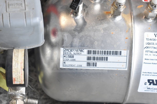 Two carbonators with serial number ZMC877070C, item code 41568. Includes labels with equipment and connection details.