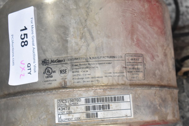 Two McCann's carbonators with labels showing model 75Z, PSI settings, and serial number 43473. Used condition.
