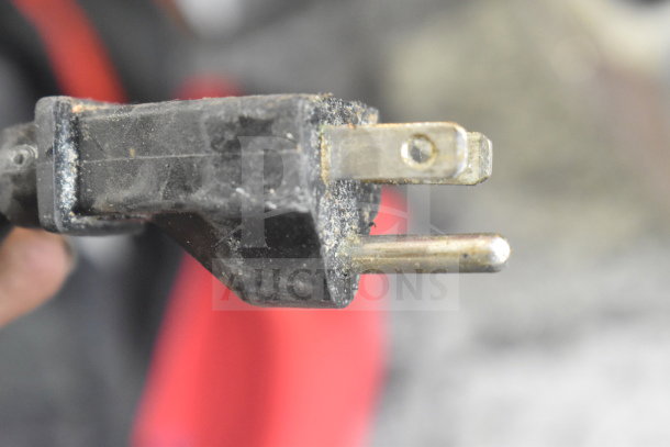 Close-up of power plug from Waring Countertop Food Processor, 115 Volts, 1 Phase, showing wear and aging.