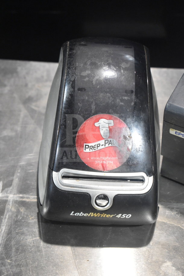 Dymo LabelWriter 450 printer with visible Prep-Pal sticker on top, showing signs of wear.