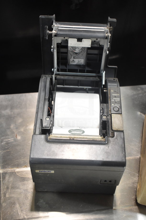 Epson M244A receipt printer, open with paper roll. Features labels and control buttons. Good condition.