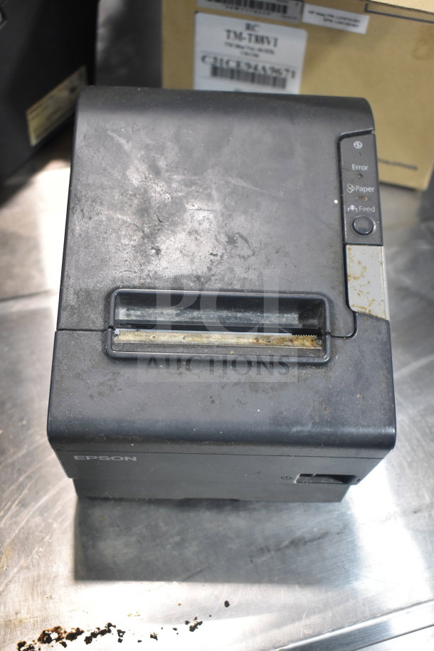 Epson receipt printer M129H, used condition, with visible wear and dirt marks. auction item includes two other printers.