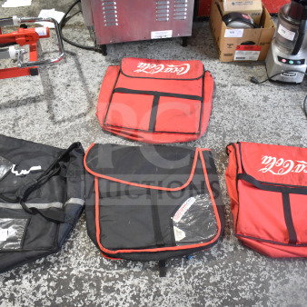 Four hot food catering carrying bags, two red with "Coca-Cola" logo, and two black with reflective stripes, slightly worn condition.