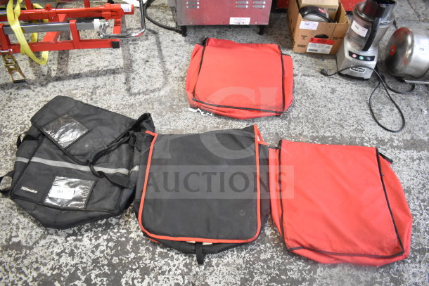 Four hot food catering carrying bags in red and black, with carrying straps, visible wear. Includes brand markings and ID tags.