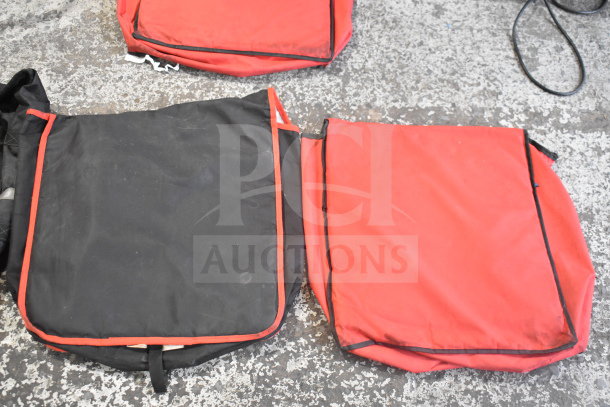 Four insulated hot food catering bags, red and black, used condition. Ideal for food transport. No visible markings.