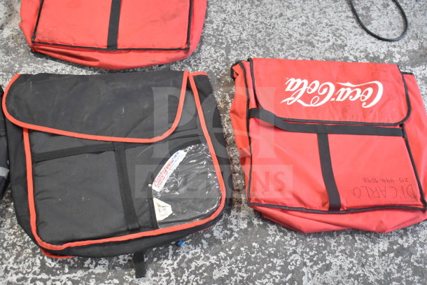 Four hot food catering bags, red and black, with Coca-Cola branding and Carry logo. Visible wear, ideal for food transport.