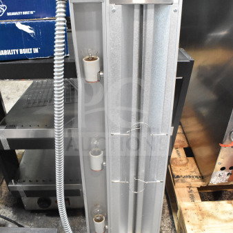 Brand new ServIt 423SW36TLHA 36" lighted strip warmer with single toggle control. Shows scratch and dent condition. 120V, 1 phase. Warning label visible.