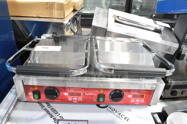 Brand new Avantco 177PG400T commercial dual panini grill with timer, grooved plates, 19 5/8" x 9 1/8" surface, 120V.