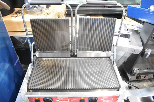 Avantco 177PG400T commercial dual panini grill with grooved plates, timer, and 19 5/8" x 9 1/8" surface, 120V. Brand new, scratch and dent.