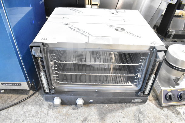 2025 Cadco OV-013 XAF013-US commercial convection oven, missing door, countertop model, 120V, 1 phase, visible control knobs.