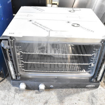 2025 Cadco OV-013 XAF013-US commercial convection oven, missing door, countertop model, 120V, 1 phase, visible control knobs.