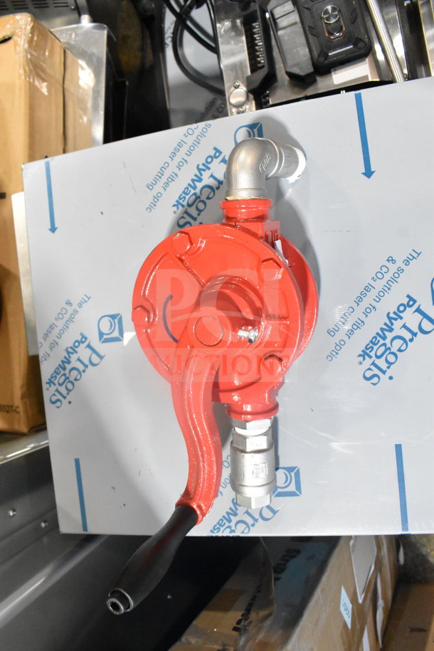 Red and chrome finish pump unit with a lever handle, used for fuel transfer. In excellent condition, includes a silver elbow joint.