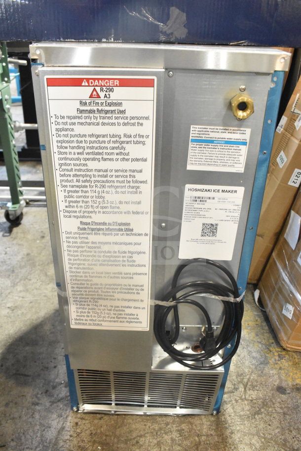 Brand new Hoshizaki AM-50BAK undercounter ice machine, top hat cubes, 27 lb. bin, 54 lb. production, 115V, visible warning labels.