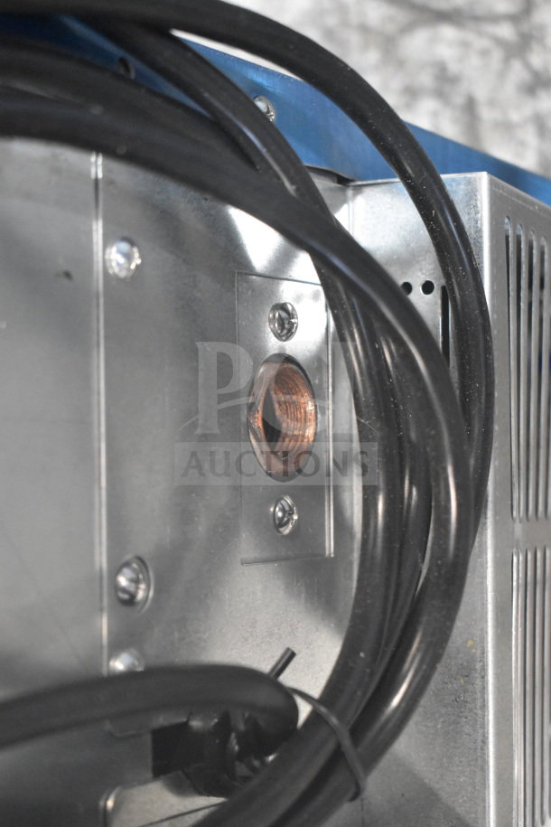 Brand new Hoshizaki AM-50BAK undercounter ice machine detail, showing wiring and metal components.