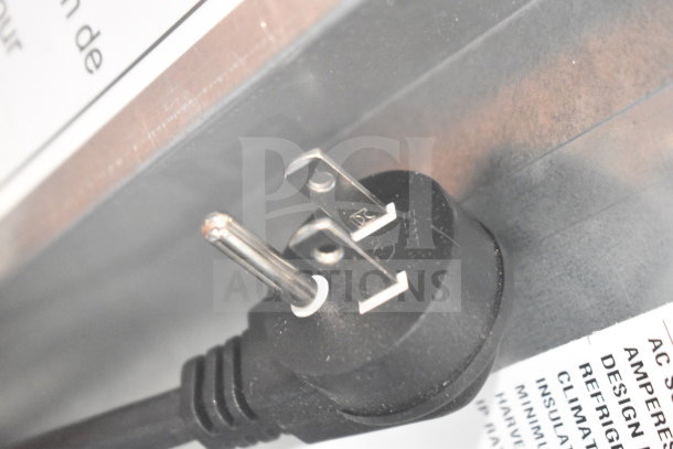 Close-up of a power plug attached to a BRAND NEW SCRATCH AND DENT Hoshizaki AM-50BAK Ice Machine.