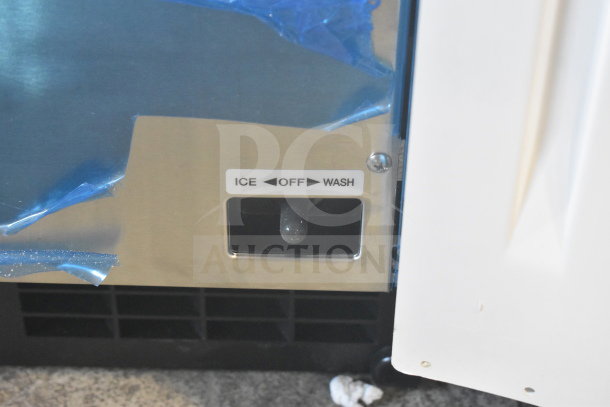 BRAND NEW Hoshizaki AM-50BAK undercounter ice machine with 27 lb. bin, showing control panel with ICE, OFF, WASH settings.