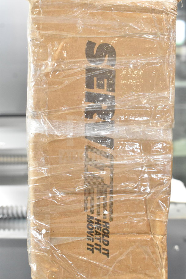 BRAND NEW SCRATCH AND DENT! ServIt 60" Lighted Strip Warmer in sealed box, 1,750W, 120V, single toggle control noted.