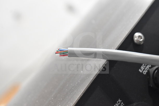 Close-up of a cable from a 2020 Enercon LM5431-T07 Super Seal Max Induction Cap Sealer. Features visible wiring.