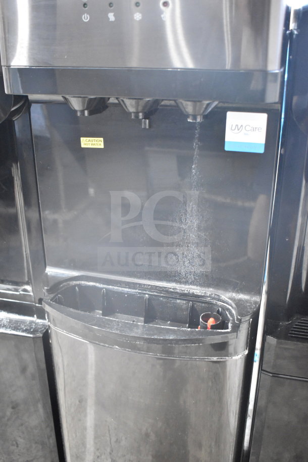Brio CLPOU520UVF2BLK floor water purifier, black, caution label on hot water spout, UV Care branding, excellent condition.