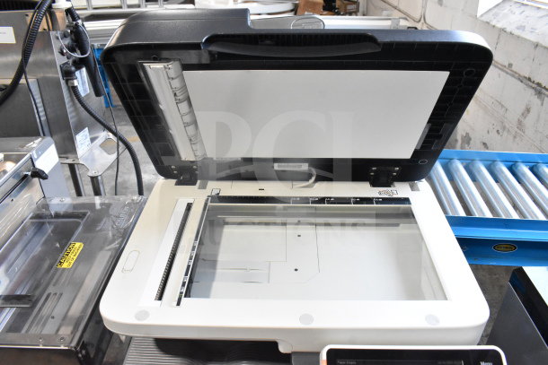 Konica Minolta Bizhub C3350 floor style scanner copier printer, open lid showing glass scanning bed, used condition.