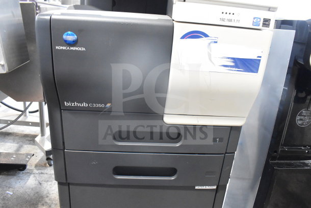 Konica Minolta Bizhub C3350 printer, black exterior, visible control panel, minor wear, floor-standing model.