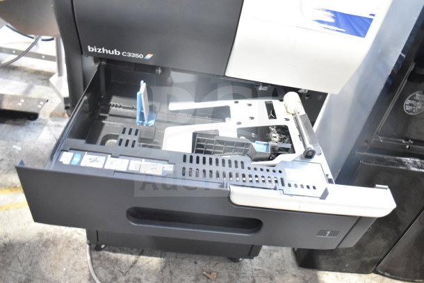 Konica Minolta Bizhub C3350 floor style scanner copier printer with open paper tray. Visible model label and internal components.