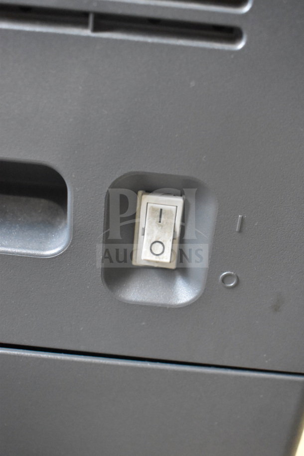 Power switch on a Konica Minolta Bizhub C3350 scanner/copier/printer. Visible on/off markings.