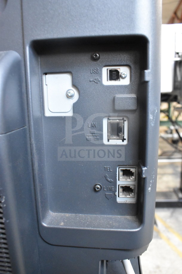 Konica Minolta Bizhub C3350 ports panel with USB, LAN, and phone line connections, showing connectivity options.