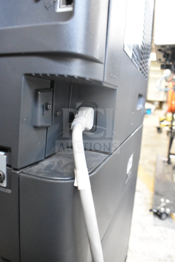 Konica Minolta Bizhub C3350 printer with visible power cable, showing external condition and connection ports.