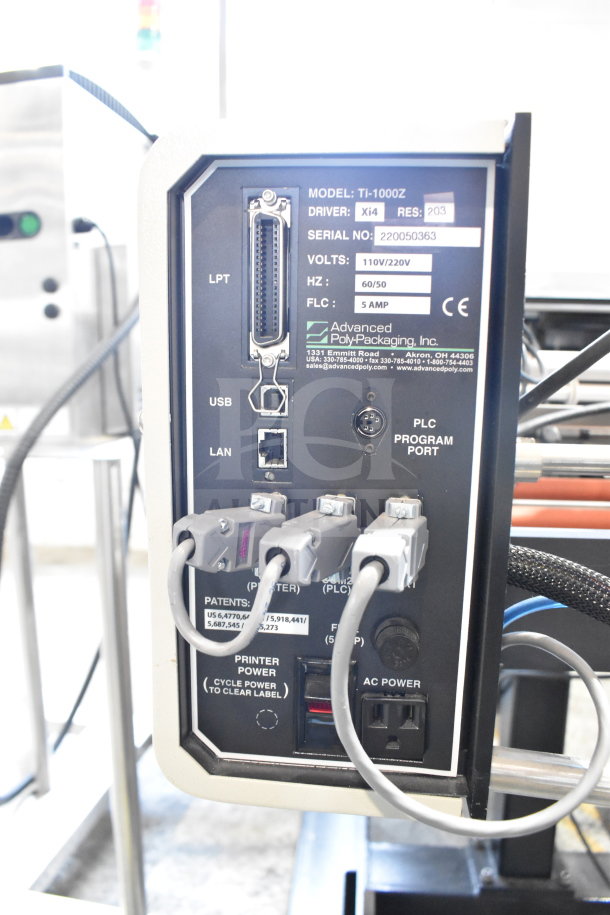 Advanced Poly Packaging T-1000 Bagger, model TI-1000Z, shown with ports and labels indicating 110/220V, 5 AMP.