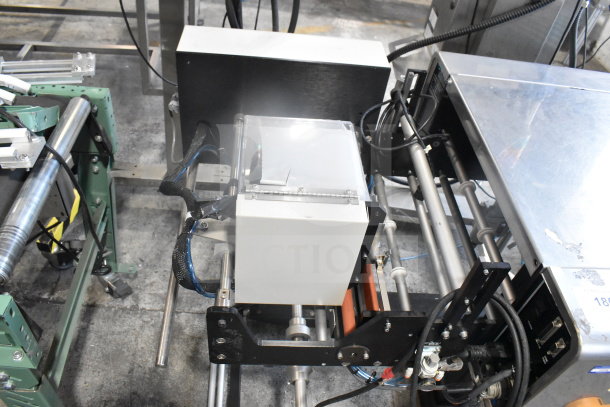 Advanced Poly Packaging T-1000 Bagger, 117/220V, steel frame, wiring visible, in good condition.
