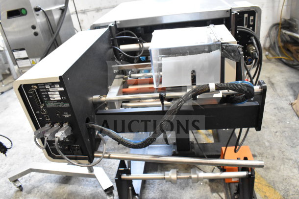 Advanced Poly Packaging T-1000 Poly Bagger in good condition, 117/220 volts. Features control panel and multiple connectors.