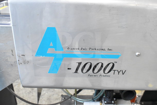 Advanced Poly Packaging T-1000 bagger, 117/220V, features company logo and model number on stainless steel panel.