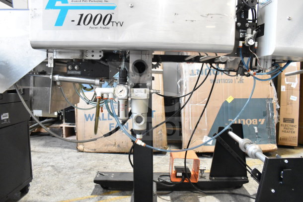 Advanced Poly Packaging T-1000 Bagger, 117/220V, features control panel and wiring, good condition, model markings visible.