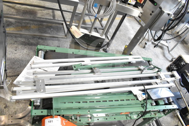 Roach Floor Style Conveyor, 115 Volts, 1 Phase. Features green metal frame, visible wiring, and operational controls.