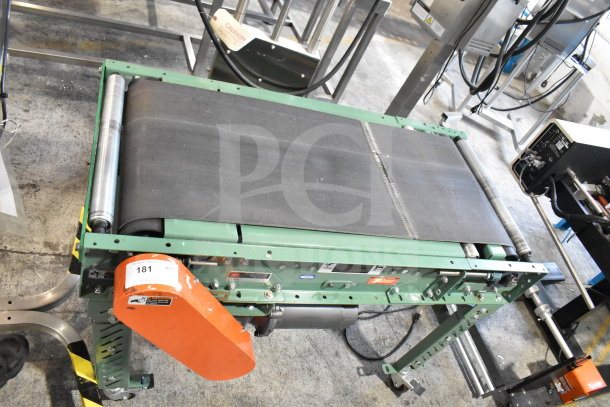 Roach floor style conveyor, 115 volts, 1 phase, green and black finish, good condition, visible caution label.