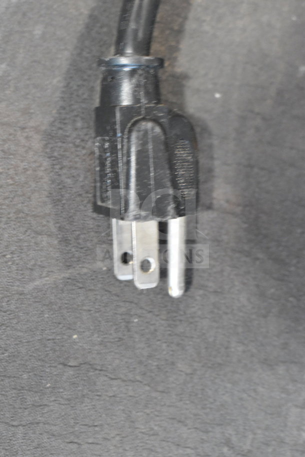 "Roach Floor Style Conveyor plug, 115 volts, 1 phase, black casing, in used condition."
