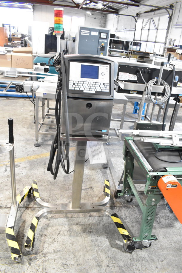Videojet 1620 inkjet printer, floor style, 100-240V, 1 phase, with control panel, standing on a metal base in a warehouse.
